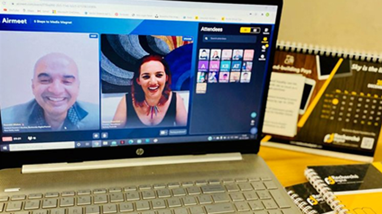 host-and-speaker-laughing-during-a-webinar